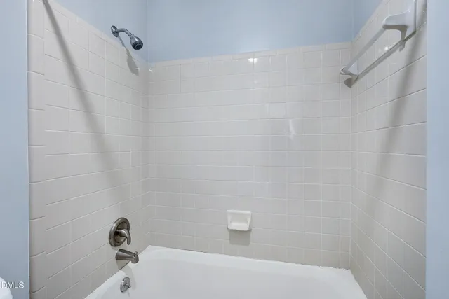 an aerial view of a house with a garden and swimming pool