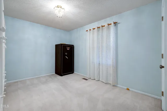 an aerial view of a house with outdoor space