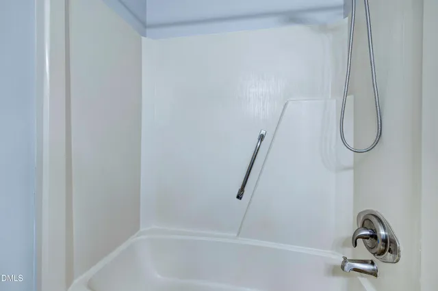 an aerial view of residential house with outdoor space and trees all around