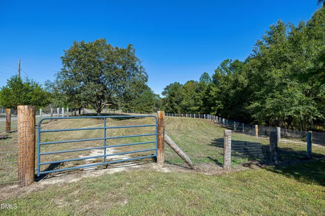 a view of a porch with wooden floor and outdoor space