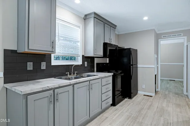 a view of a field with trees in the background