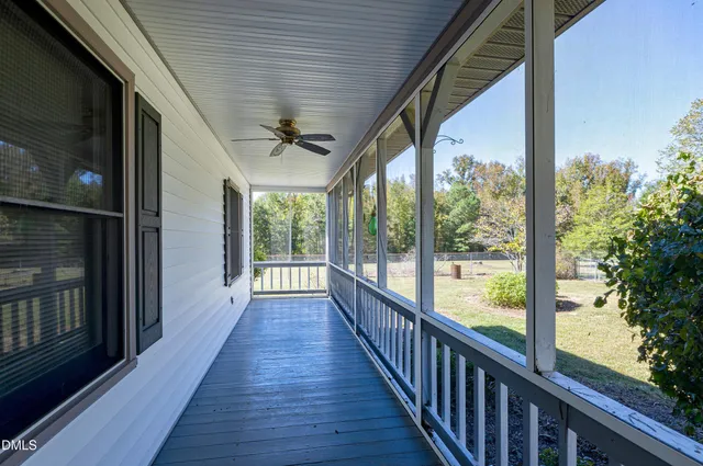 a kitchen with granite countertop a refrigerator and a sink
