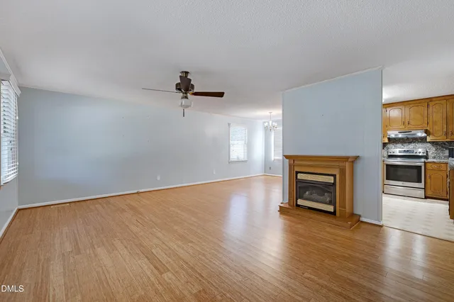 a view of living room with flat screen tv and staircase