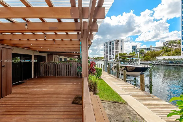 a view of a balcony with wooden floor