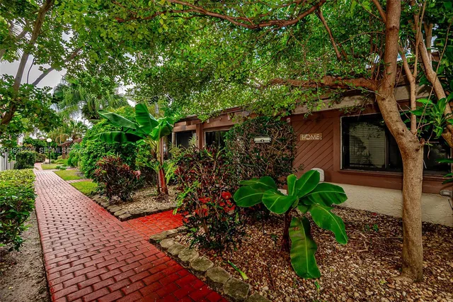 a plant that is in front of a house