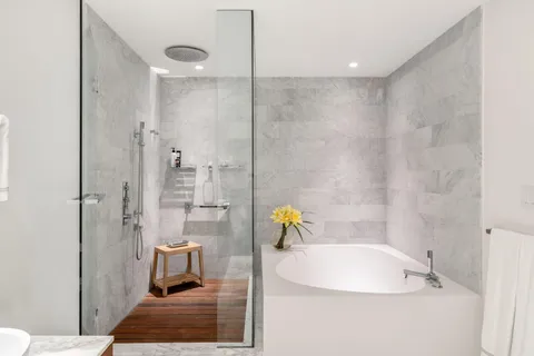 a bathroom with a double vanity sink mirror and