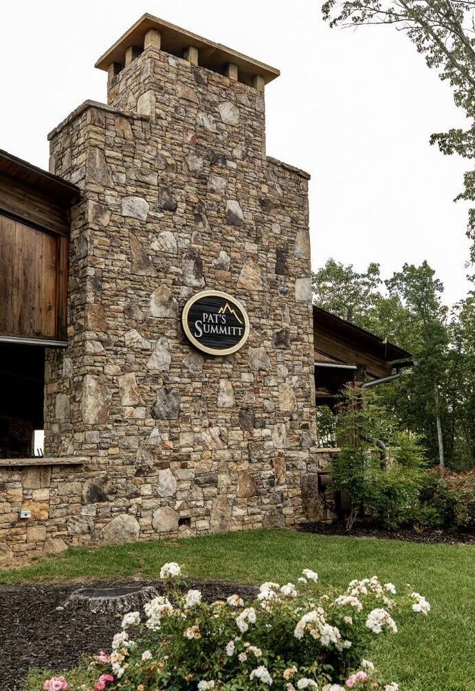 5140 Crockett Pointe Jasper, TN 37347 - Photo 19 of 26 a building with garden in front of it