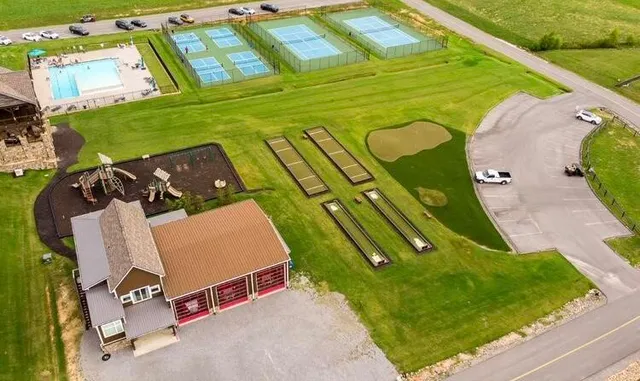 a view of a swimming pool with a yard