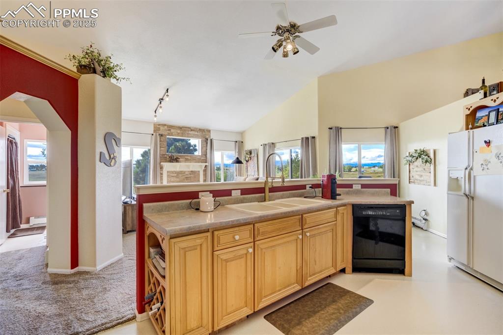 6275 Meridian Road Peyton, CO 80831 - Photo 12 of 50 a kitchen with stainless steel appliances granite countertop a sink and cabinets