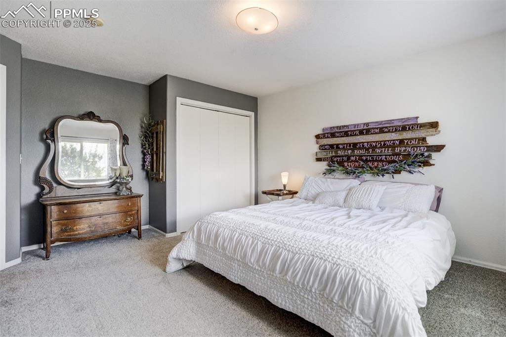 6275 Meridian Road Peyton, CO 80831 - Photo 18 of 50 a bedroom with a bed and a dresser