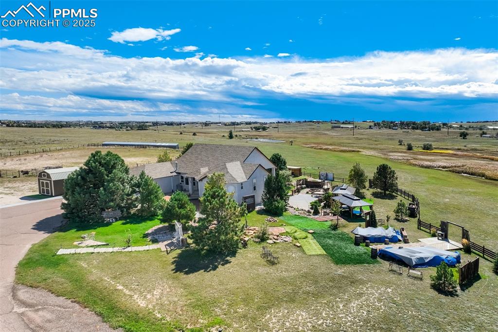 6275 Meridian Road Peyton, CO 80831 - Photo 2 of 50 a view of a lake with a yard