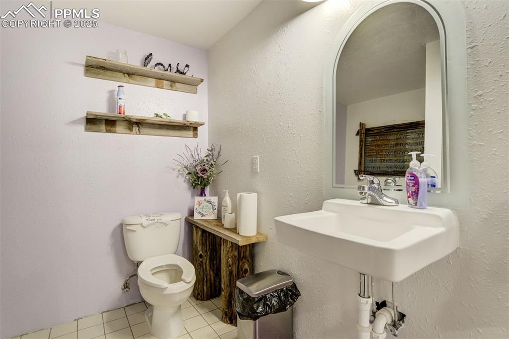 6275 Meridian Road Peyton, CO 80831 - Photo 24 of 50 a bathroom with a sink and a mirror