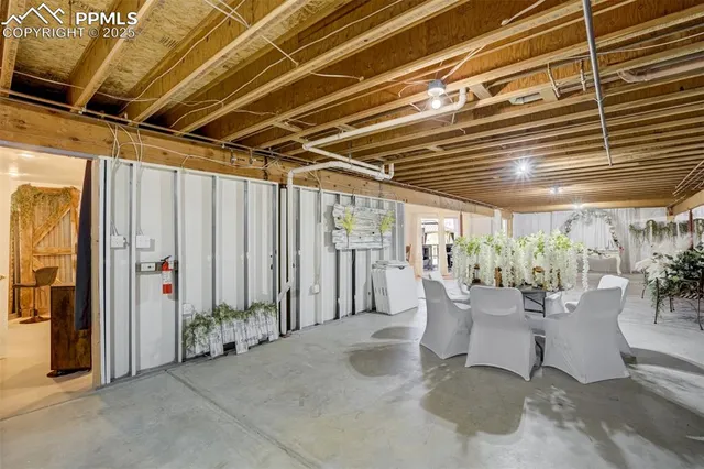 a view of a patio with table and chairs and potted plants