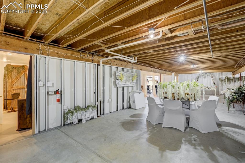6275 Meridian Road Peyton, CO 80831 - Photo 27 of 50 a view of a patio with table and chairs and potted plants
