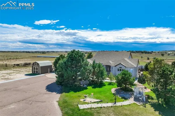 a view of a yard with an ocean view