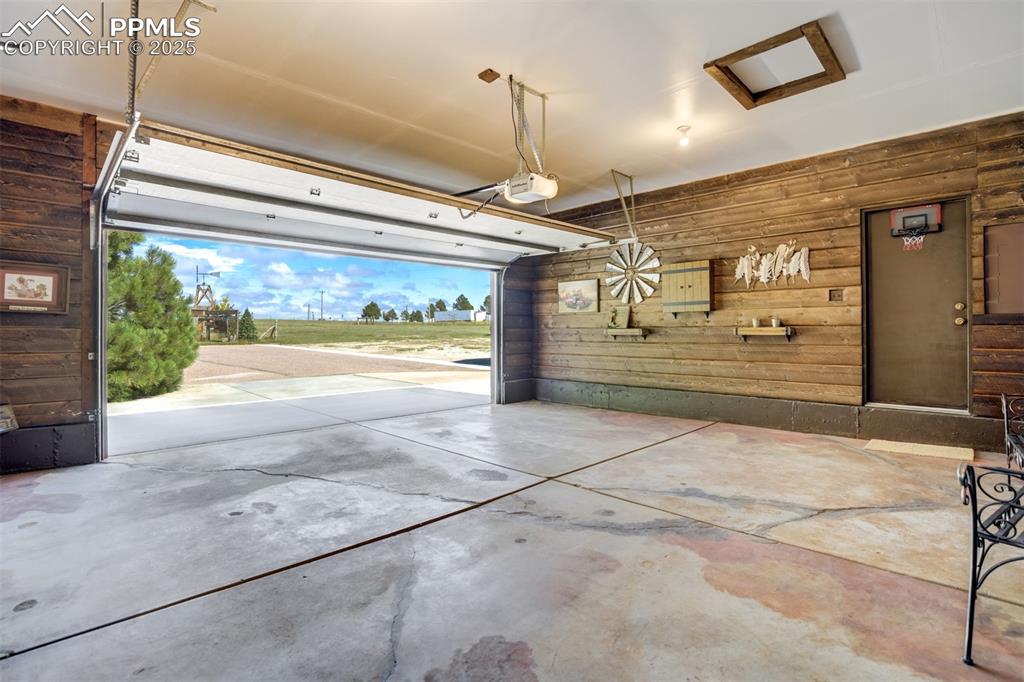 6275 Meridian Road Peyton, CO 80831 - Photo 33 of 50 a view of a garage with door