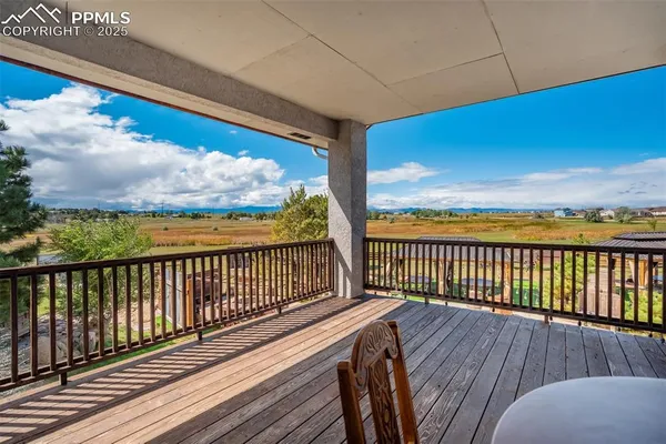 a view of balcony with wooden floor