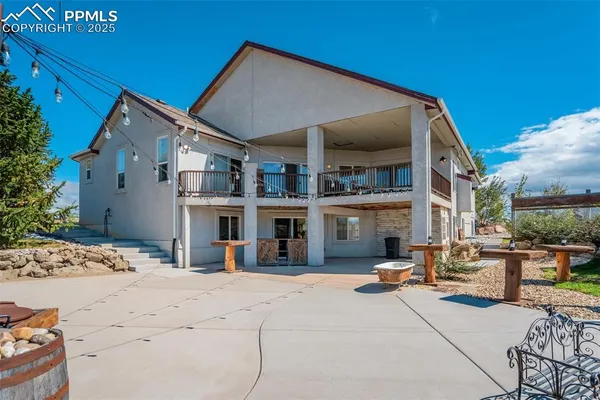 a view of a house with roof and sitting area