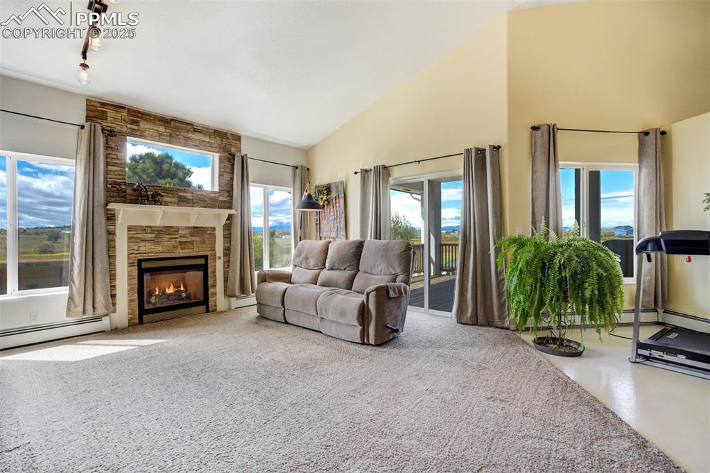 6275 Meridian Road Peyton, CO 80831 - Photo 5 of 50 a living room with furniture and a fireplace