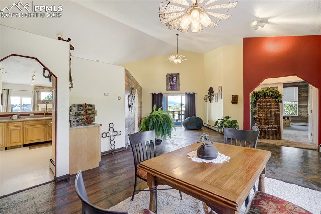 6275 Meridian Road Peyton, CO 80831 - Photo 8 of 50 a view of a dining room with furniture window and wooden floor