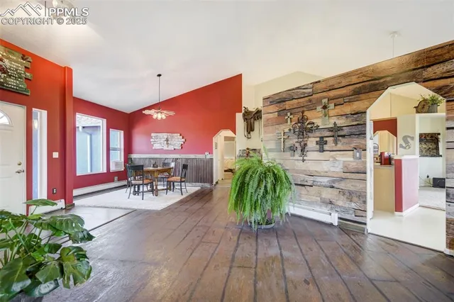 a dinning table and chairs in the patio of a house