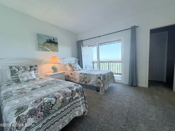 a bedroom with a bed and a table in it