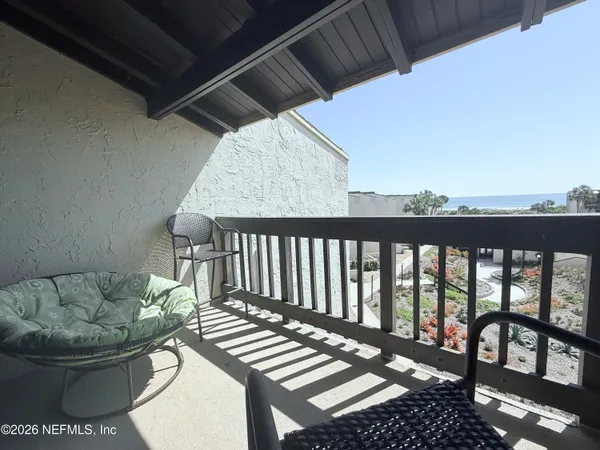 a view of balcony with furniture