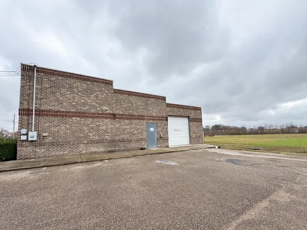 a view of an house with a garden and area