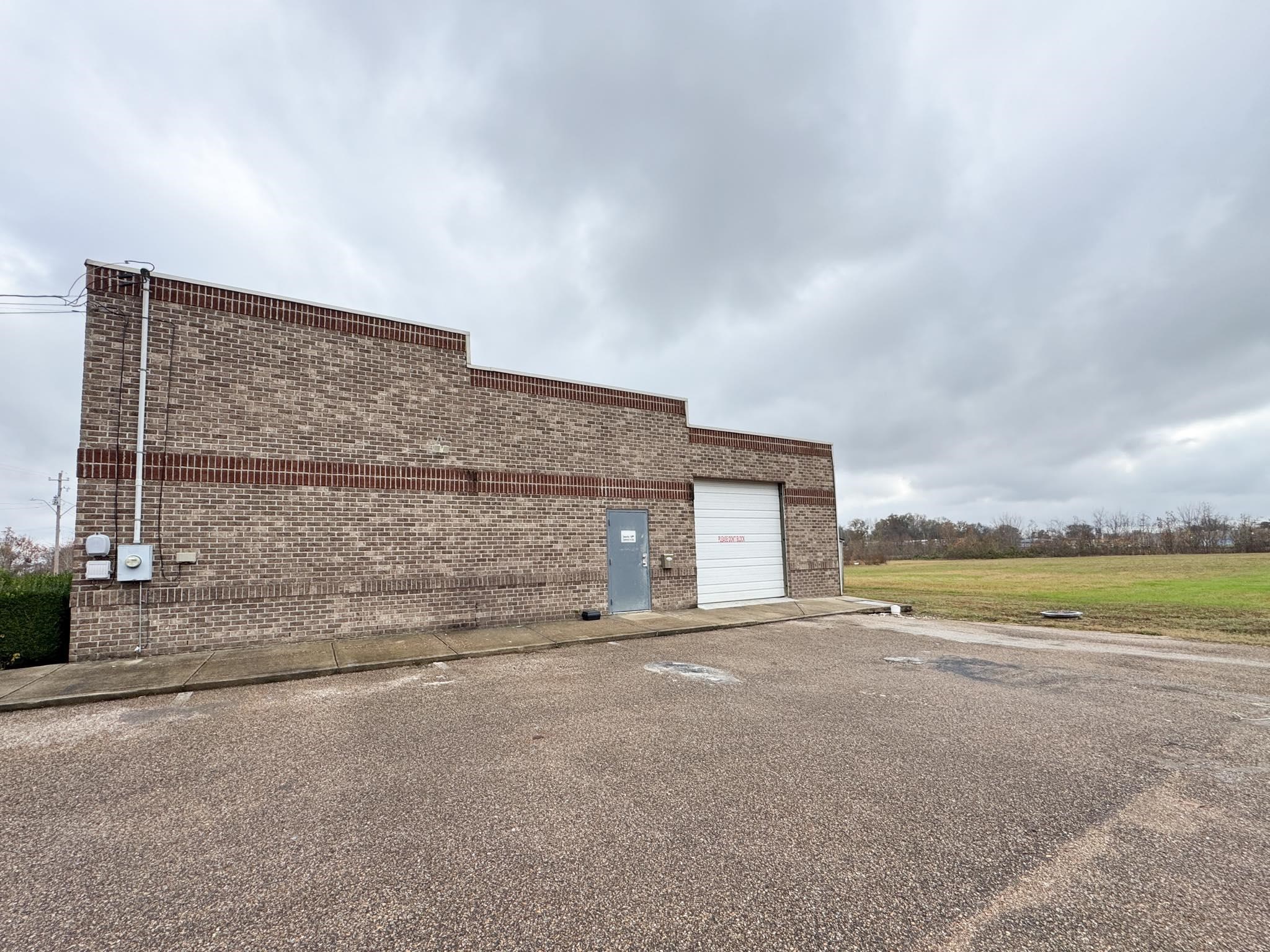 a view of an house with a garden and area
