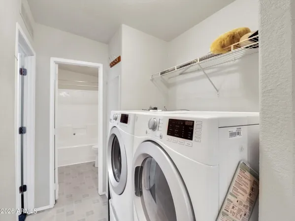 a utility room with dryer and washer