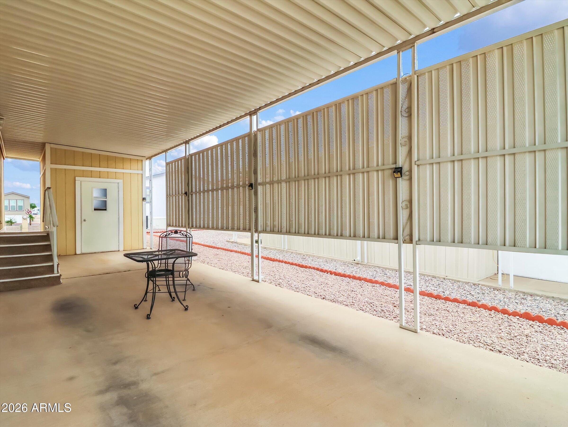 301 South Signal Butte Road, Unit 827 Apache Junction, AZ 85120 - Photo 22 of 29 covered carport to the shed