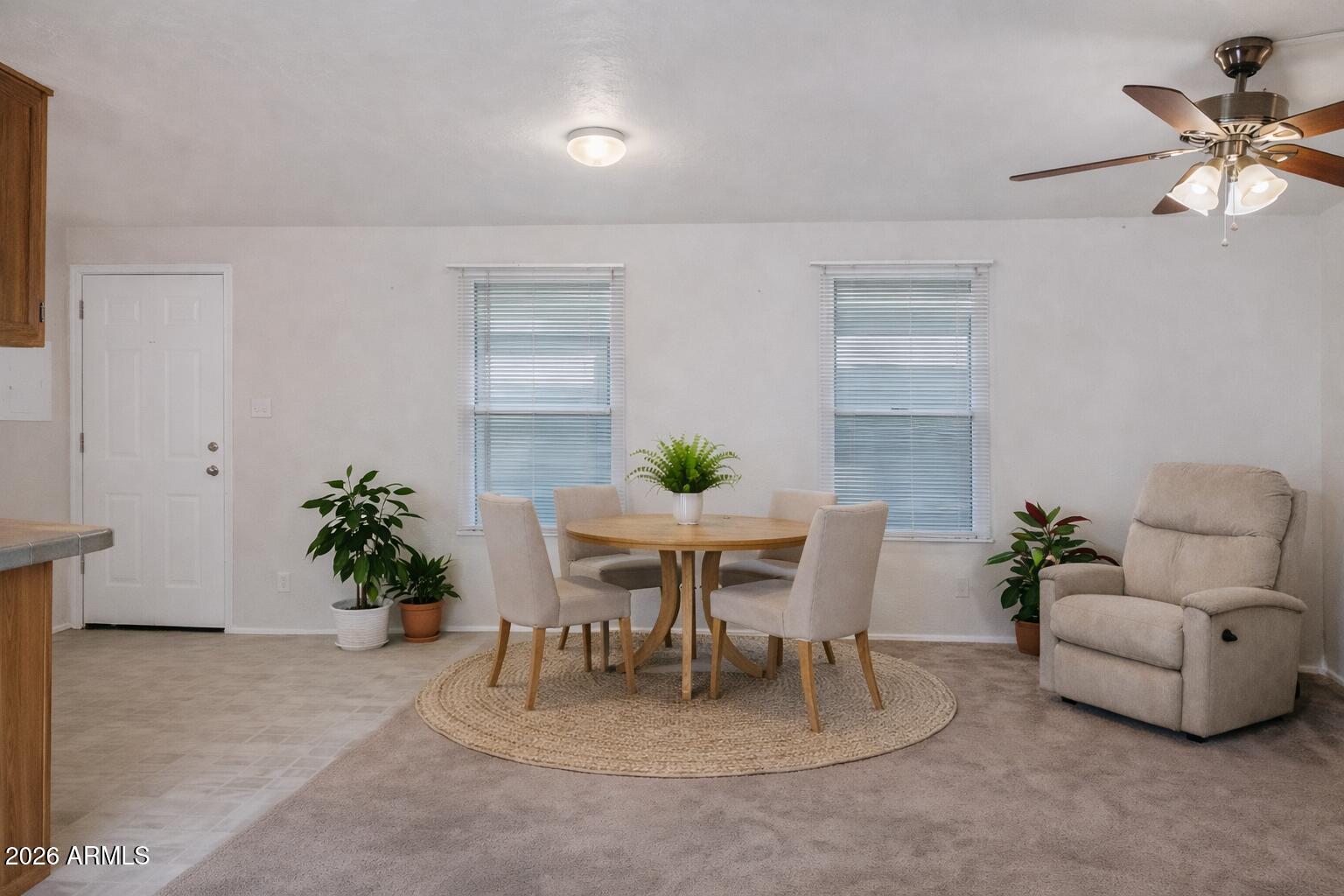 301 South Signal Butte Road, Unit 827 Apache Junction, AZ 85120 - Photo 9 of 29 Cozy dining and seating area AI staged