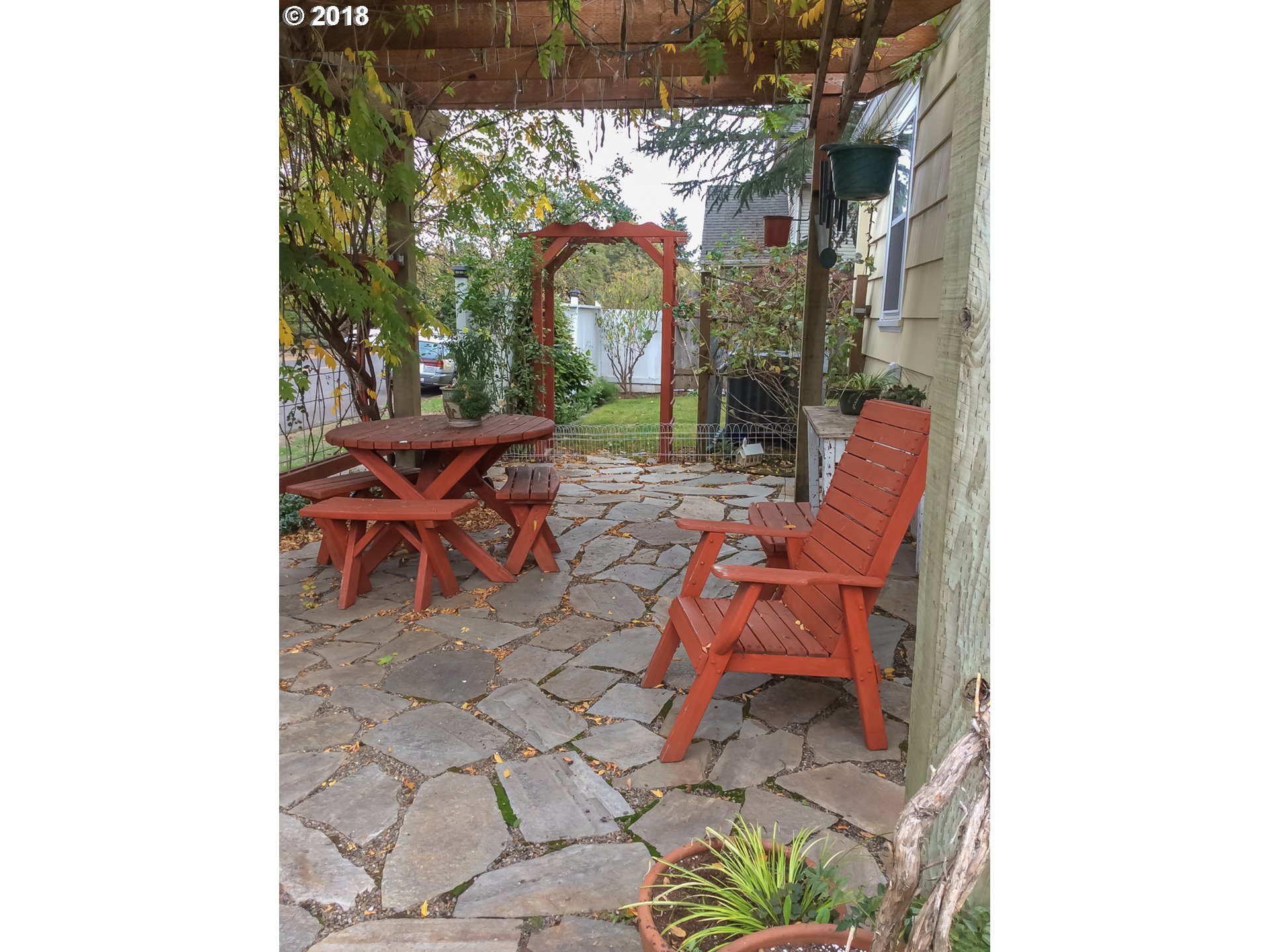551 6th Street Springfield, OR 97477 - Photo 11 of 12 a backyard of a house with table and chairs