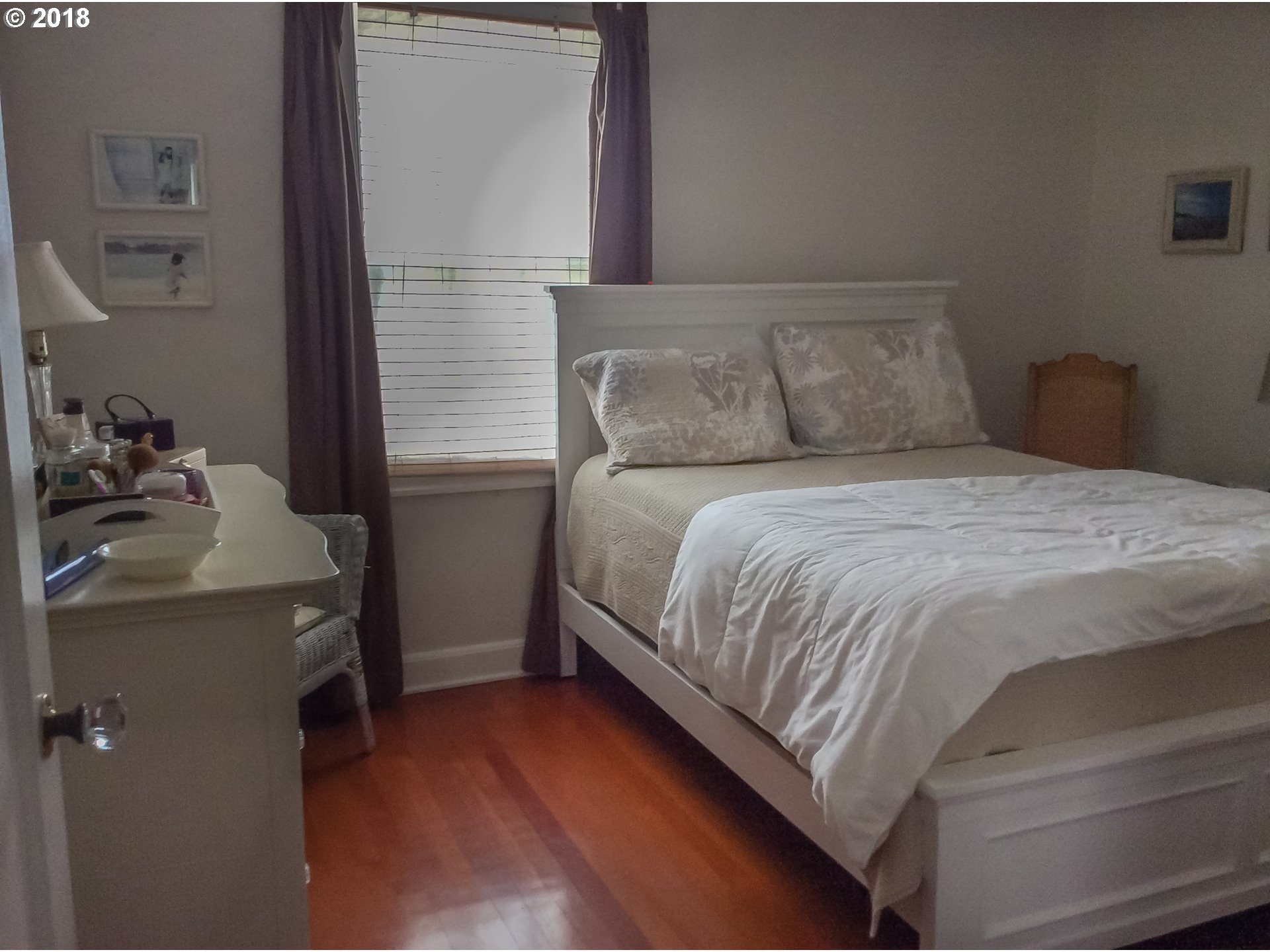 551 6th Street Springfield, OR 97477 - Photo 8 of 12 a bedroom with a bed and dresser