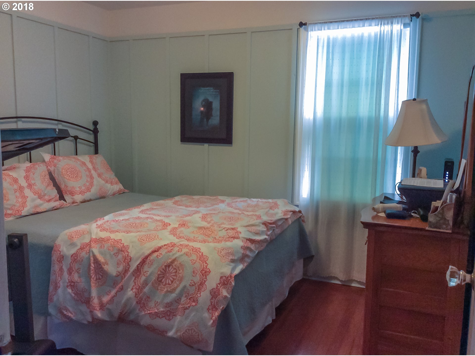 551 6th Street Springfield, OR 97477 - Photo 9 of 12 a bedroom with a bed and a table