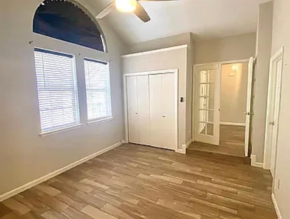 2614 Timberview Circle Corinth, TX 76210 - Photo 12 of 18 a view of an empty room with wooden floor and a window