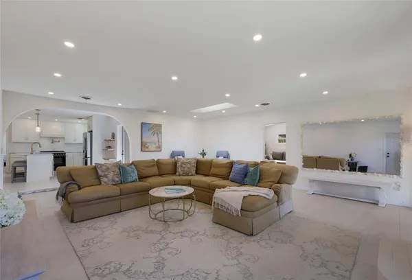 a living room with a bed furniture and a window