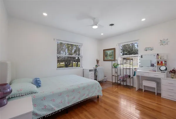 a bedroom with furniture and a window