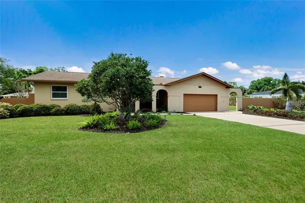 a large kitchen with a table and chairs in it