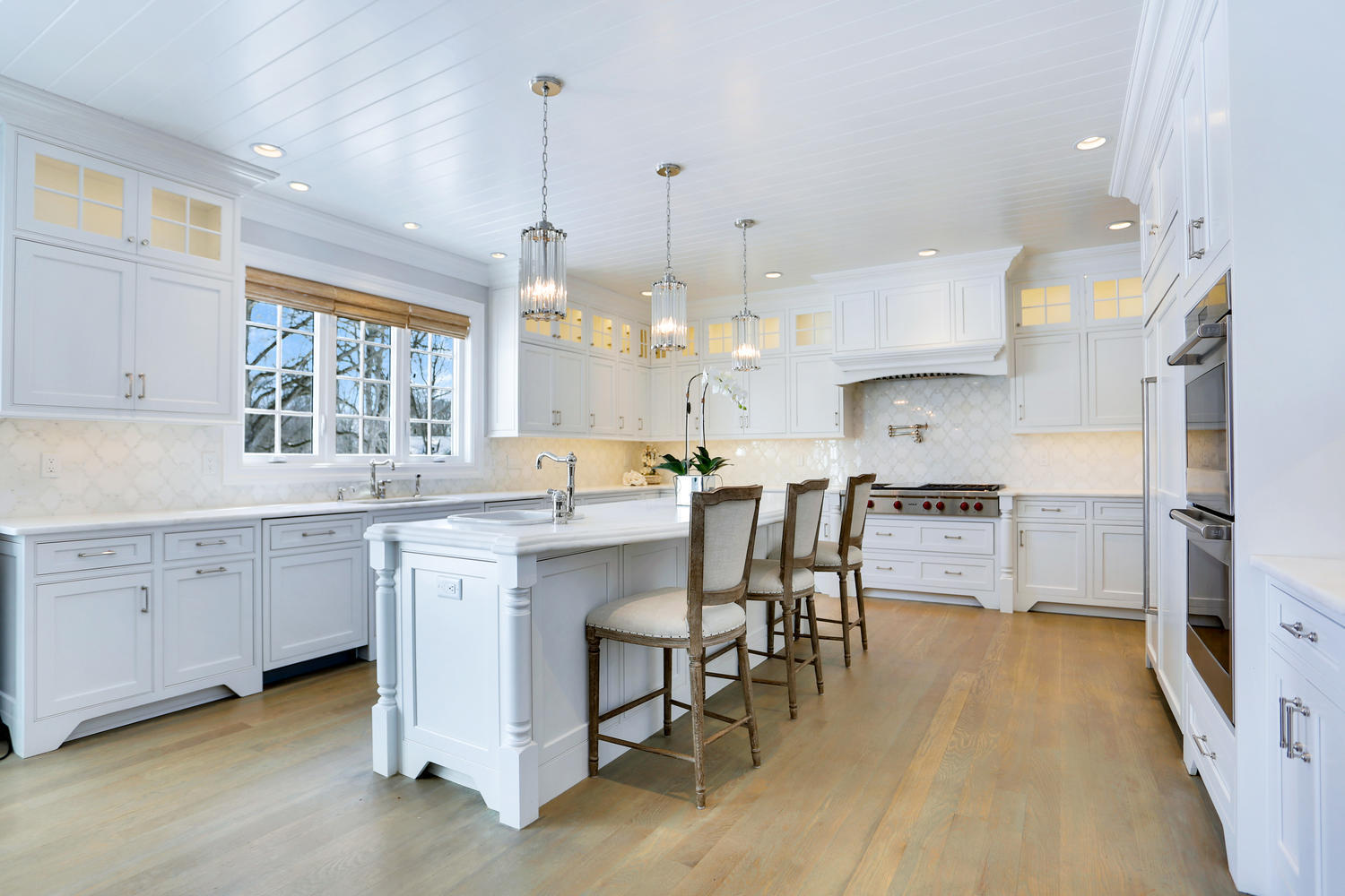 50 White Oak Shade Road New Canaan, CT 06840 - Photo 13 of 38 a kitchen with kitchen island granite countertop appliances cabinets and a sink