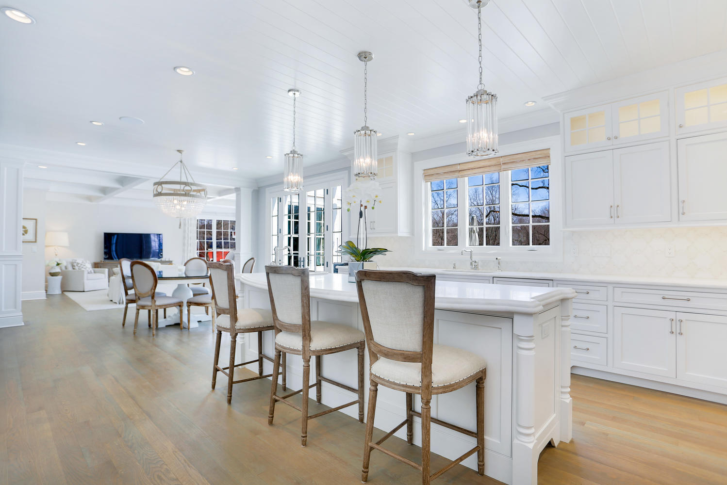 50 White Oak Shade Road New Canaan, CT 06840 - Photo 14 of 38 a view of a dining room with furniture window and wooden floor