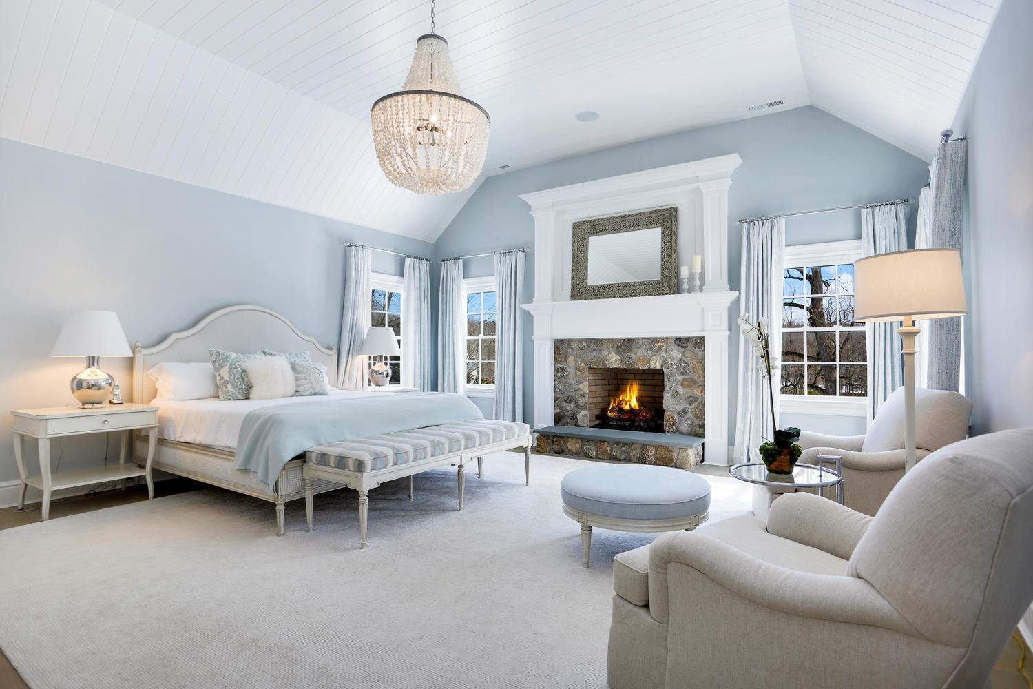 50 White Oak Shade Road New Canaan, CT 06840 - Photo 16 of 38 a bed room with furniture and a fireplace