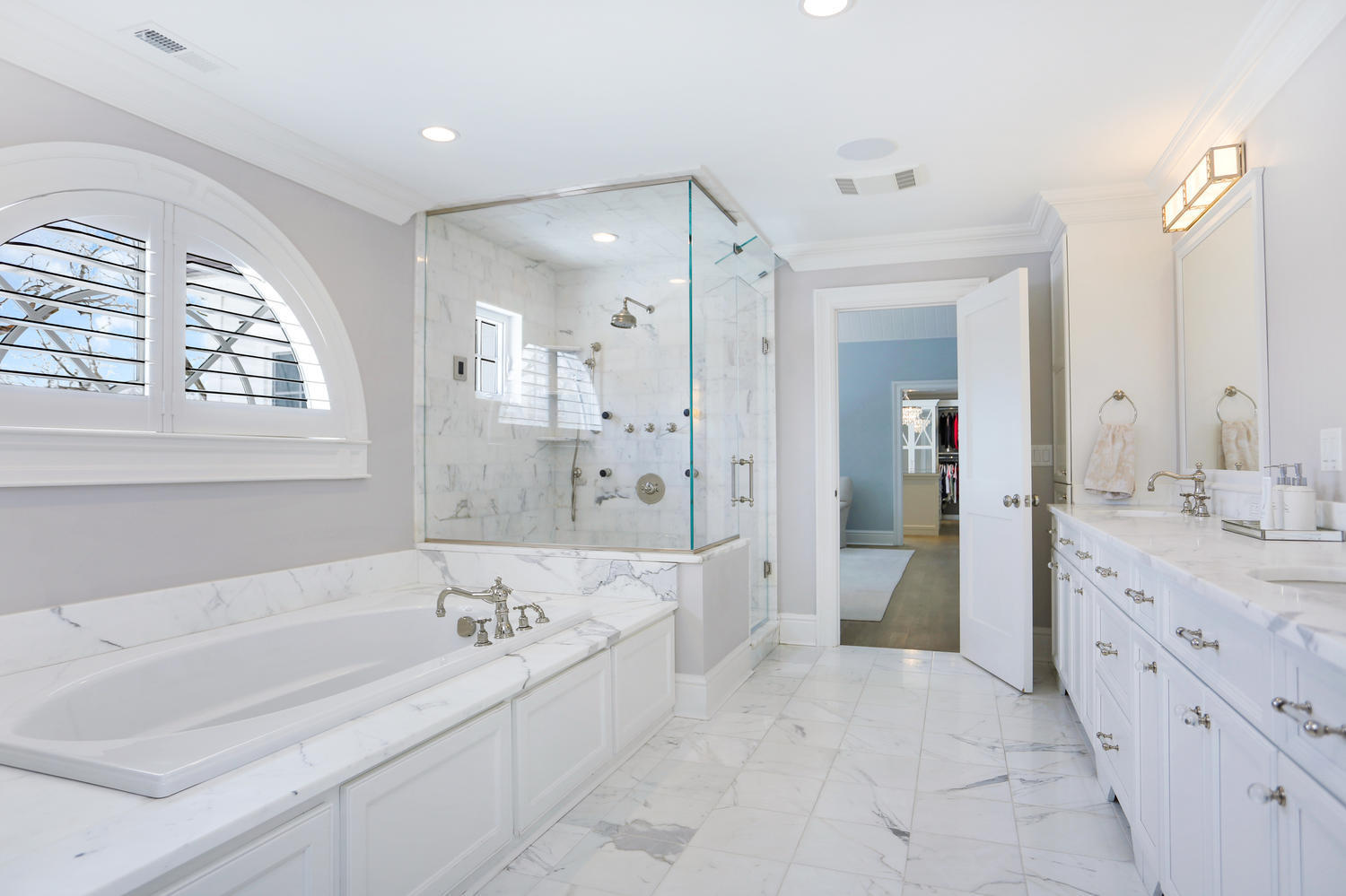 50 White Oak Shade Road New Canaan, CT 06840 - Photo 19 of 38 a spacious bathroom with a tub sink shower and mirror