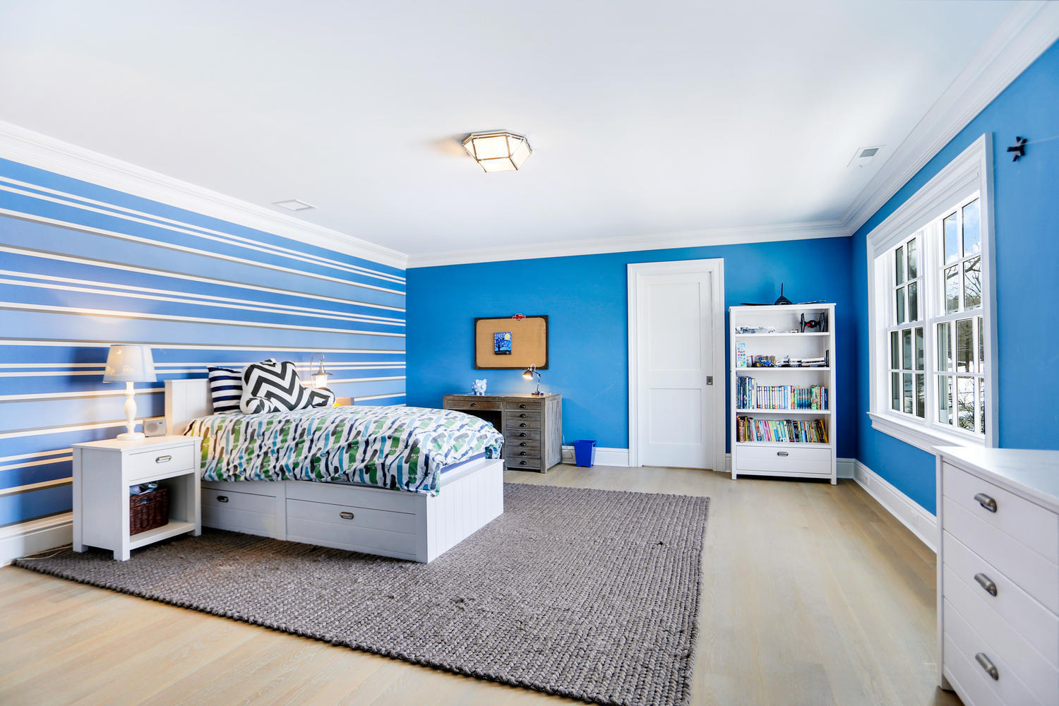 50 White Oak Shade Road New Canaan, CT 06840 - Photo 24 of 38 a spacious bedroom with a bed and a cabinets
