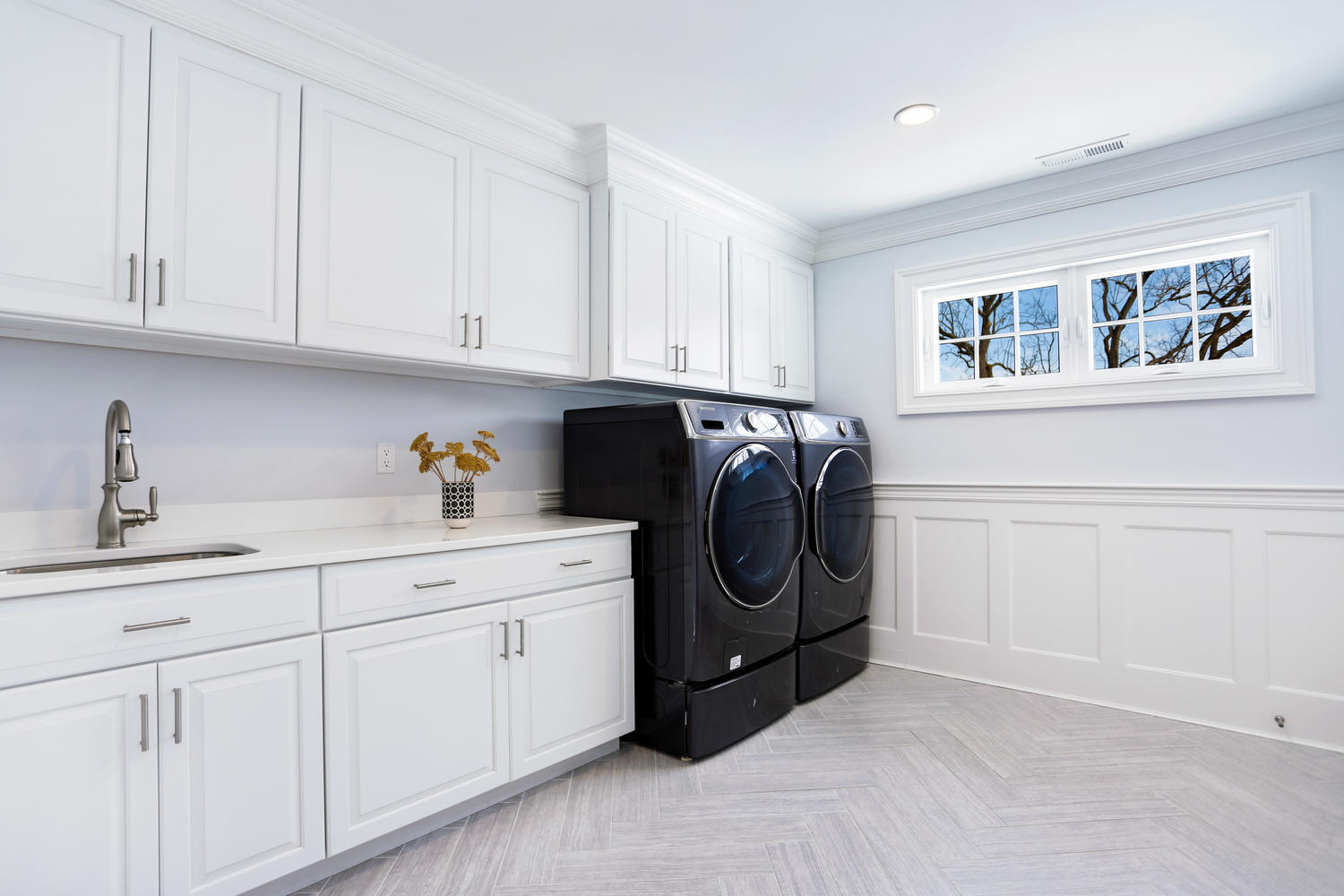50 White Oak Shade Road New Canaan, CT 06840 - Photo 28 of 38 a utility room with cabinets washer and dryer
