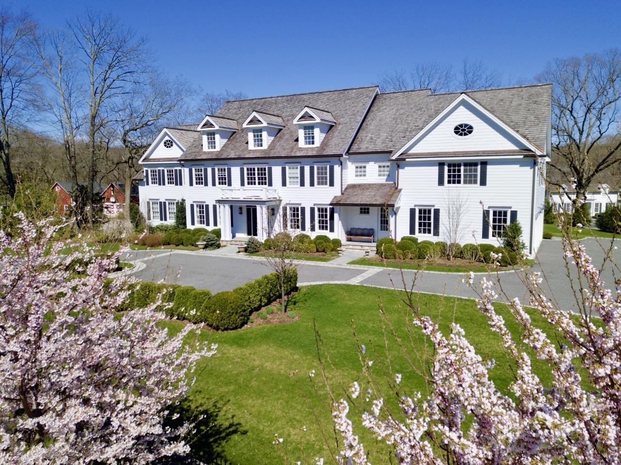 50 White Oak Shade Road New Canaan, CT 06840 - Photo 33 of 38 a front view of a house with a yard