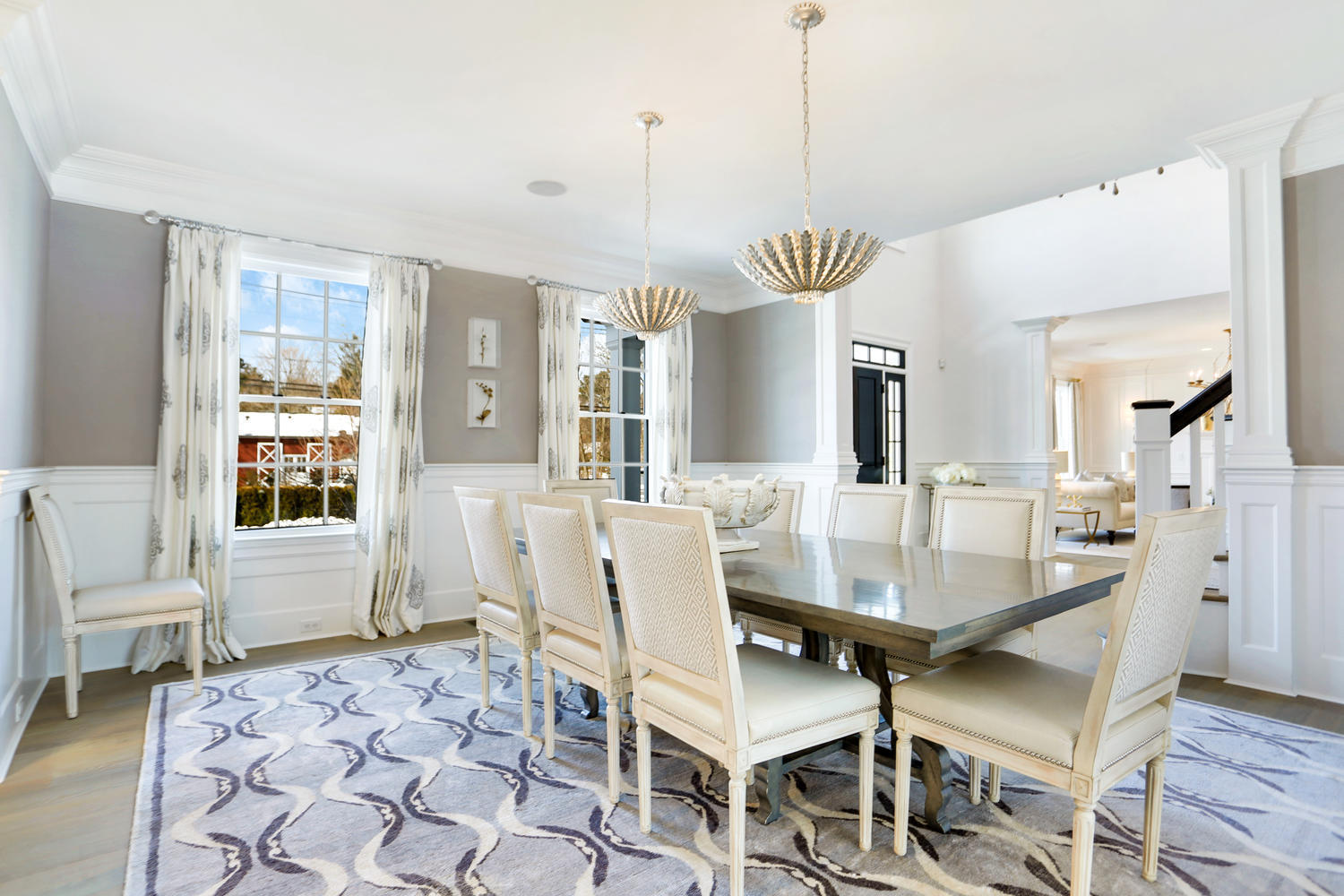 50 White Oak Shade Road New Canaan, CT 06840 - Photo 6 of 38 a dining room with furniture a chandelier and wooden floor