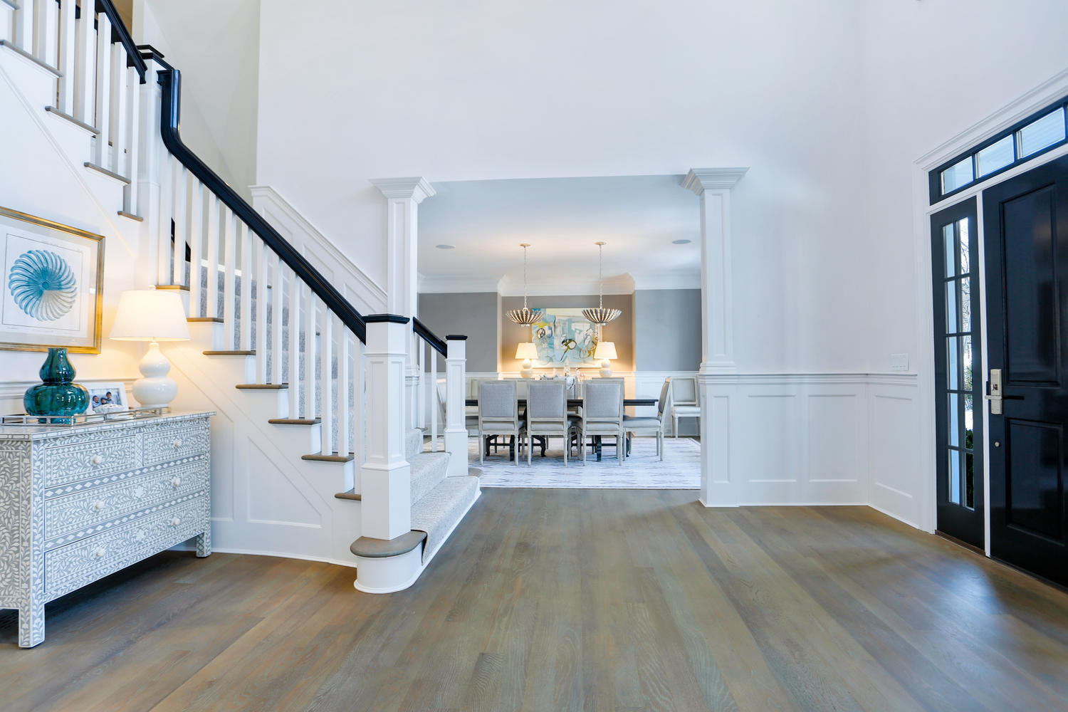 50 White Oak Shade Road New Canaan, CT 06840 - Photo 7 of 38 a view of front door with dining room and wooden floor
