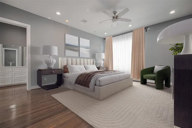 a bedroom with a large bed and a chandelier