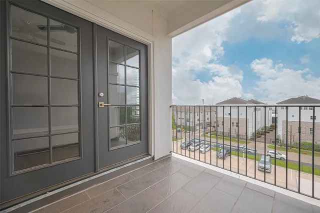 a view of a glass door with a balcony